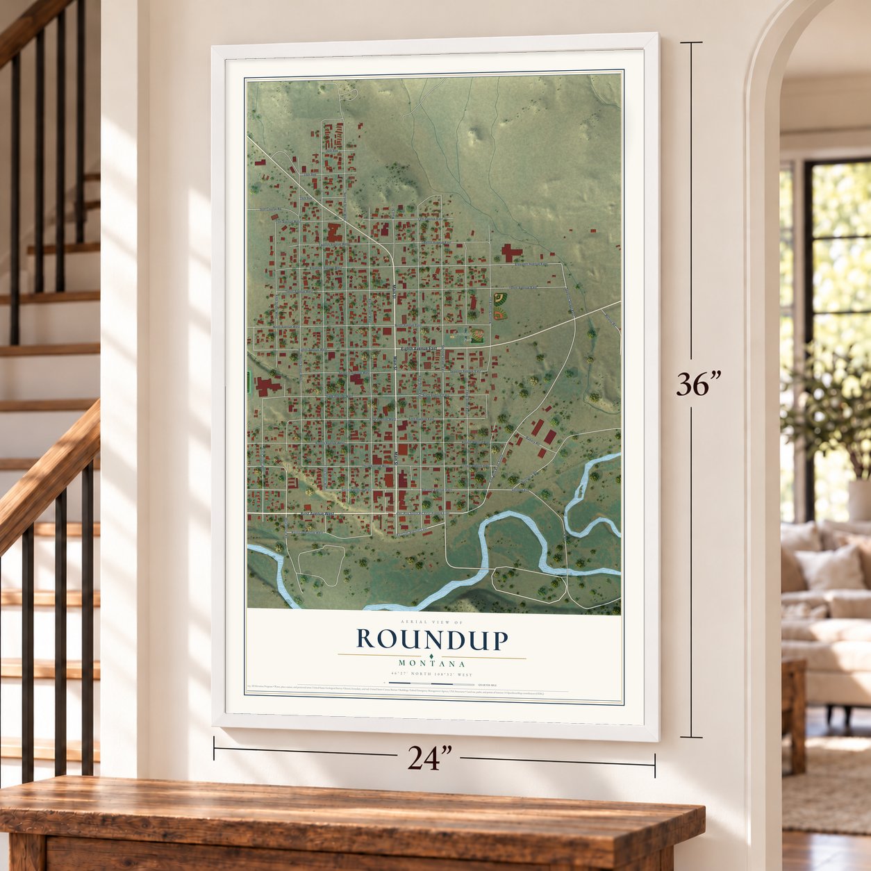 Roundup, Montana map, 24 x 36 inch print in a white frame by a staircase