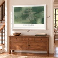 Rush Center, Kansas map, 24 x 36 inch print in a white frame above a dresser by a staircase