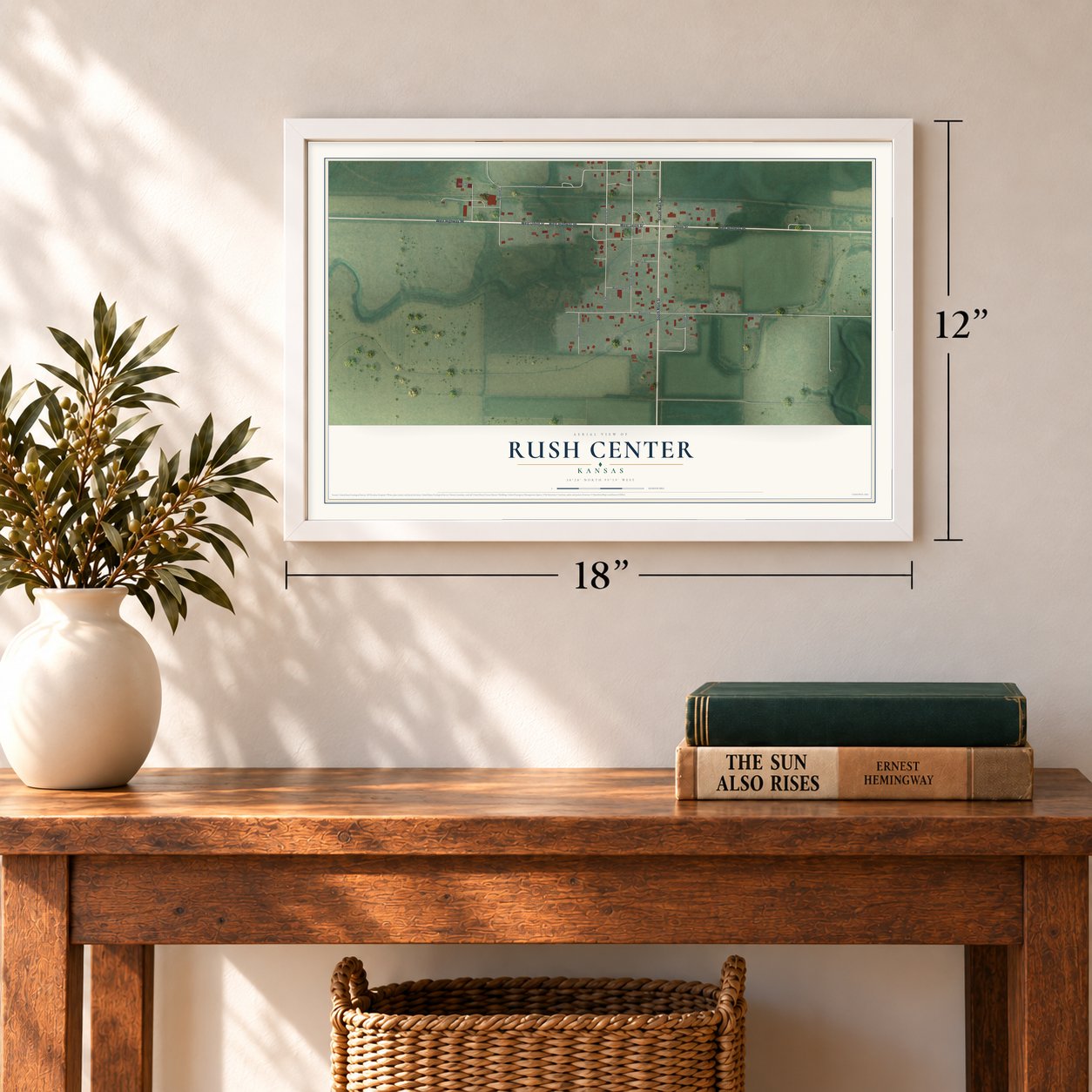 Rush Center, Kansas map, 12 x 18 inch print in a white frame in an entryway
