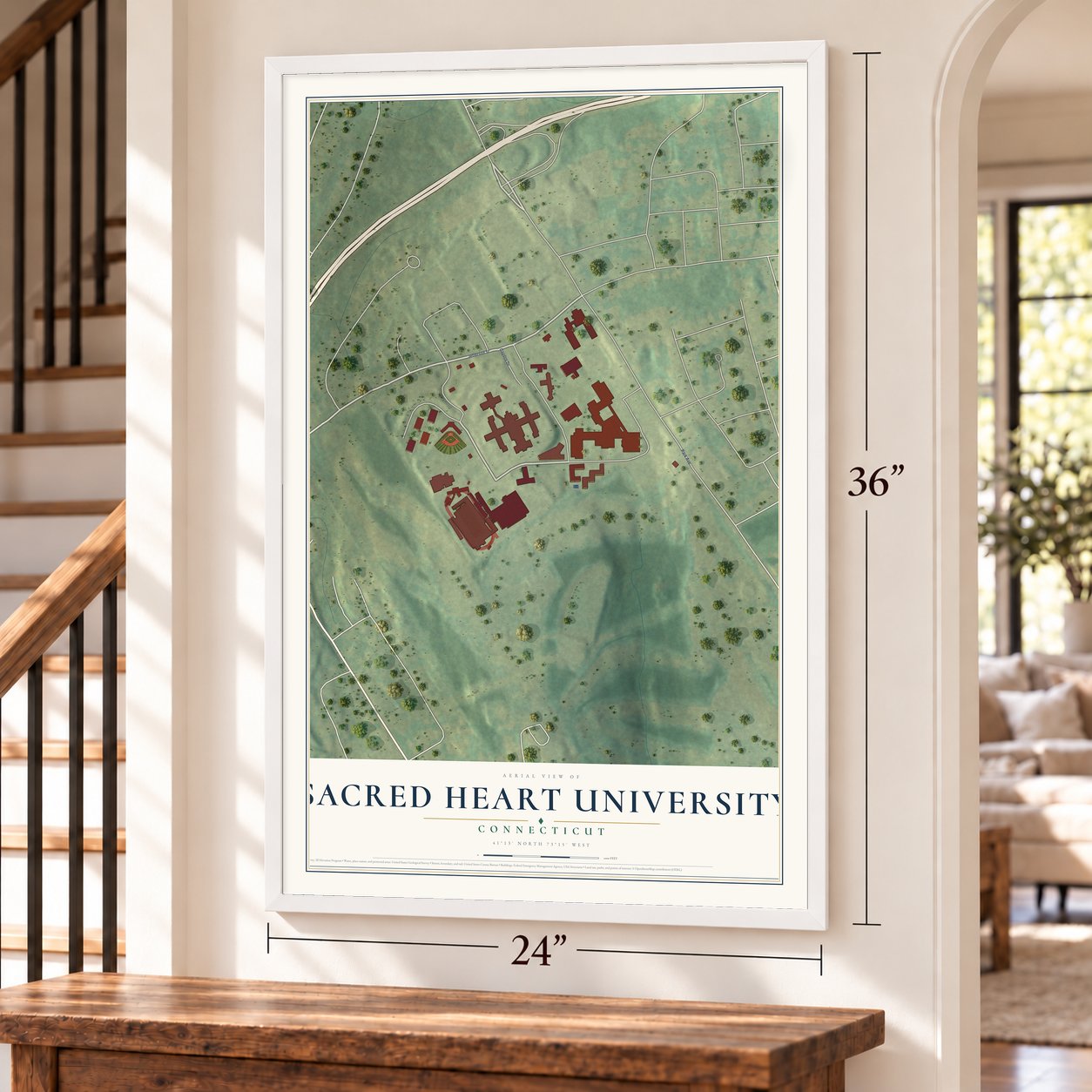 Sacred Heart University, Connecticut map, 24 x 36 inch print in a white frame by a staircase