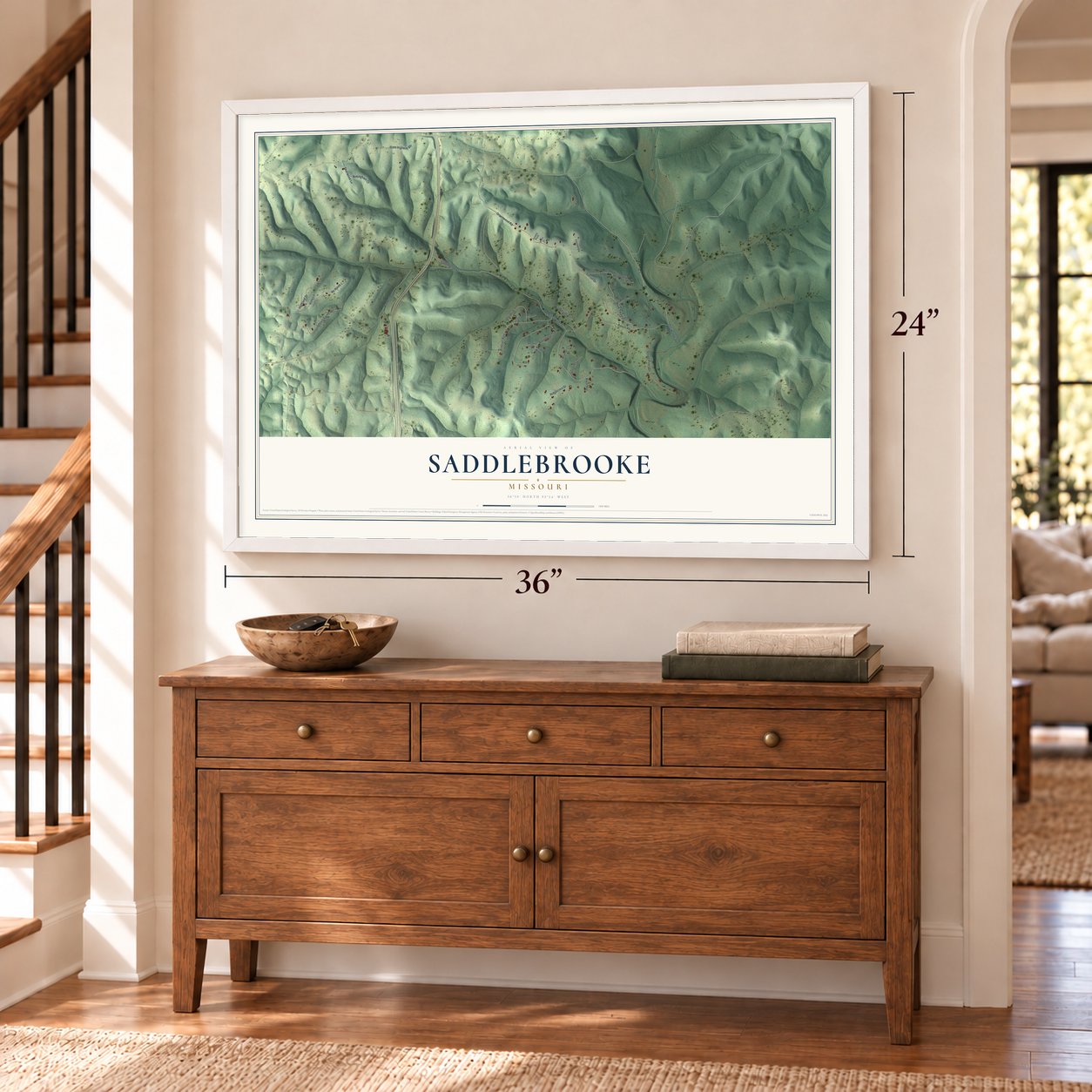 Saddlebrooke, Missouri map, 24 x 36 inch print in a white frame above a dresser by a staircase