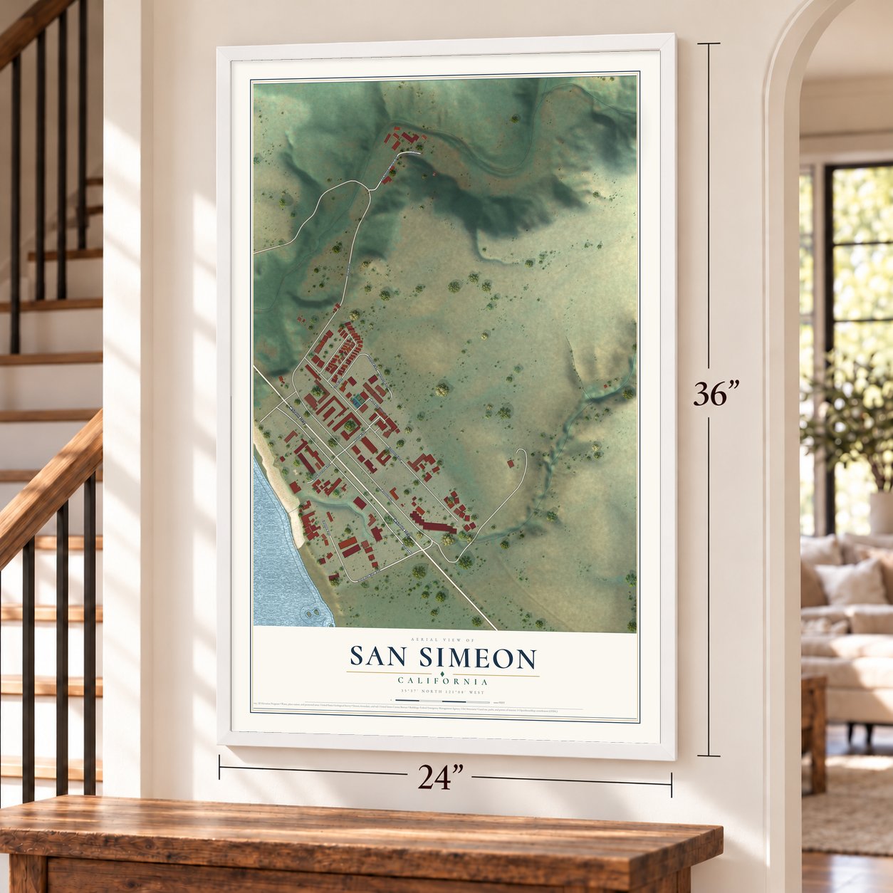 San Simeon, California map, 24 x 36 inch print in a white frame by a staircase