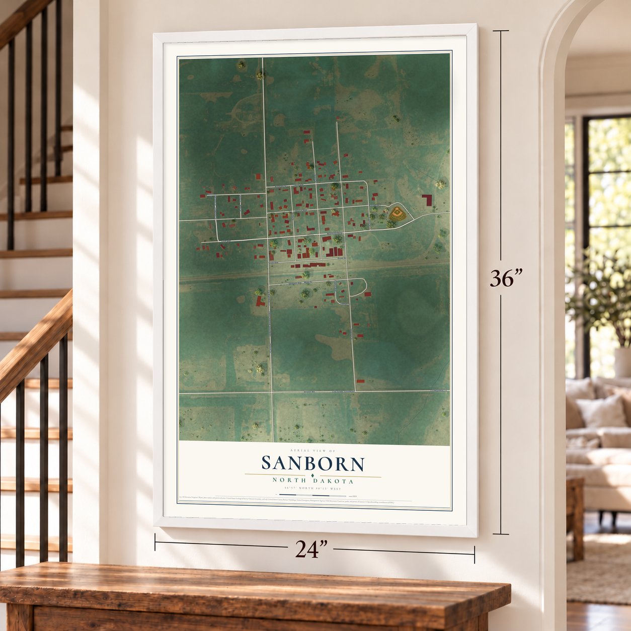 Sanborn, North Dakota map, 24 x 36 inch print in a white frame by a staircase