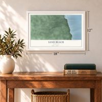 Sand Beach, Michigan map, 12 x 18 inch print in a white frame in an entryway