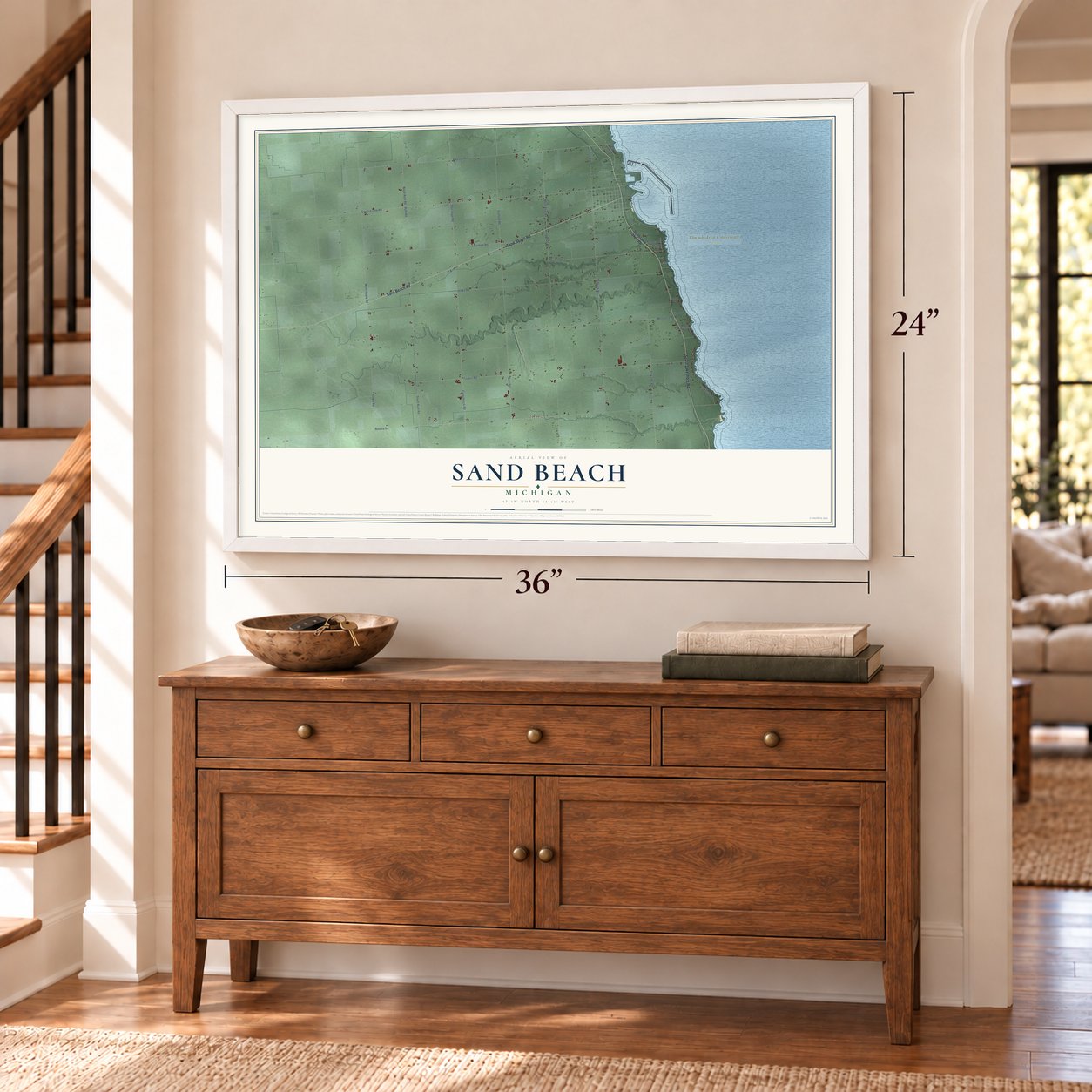Sand Beach, Michigan map, 24 x 36 inch print in a white frame above a dresser by a staircase