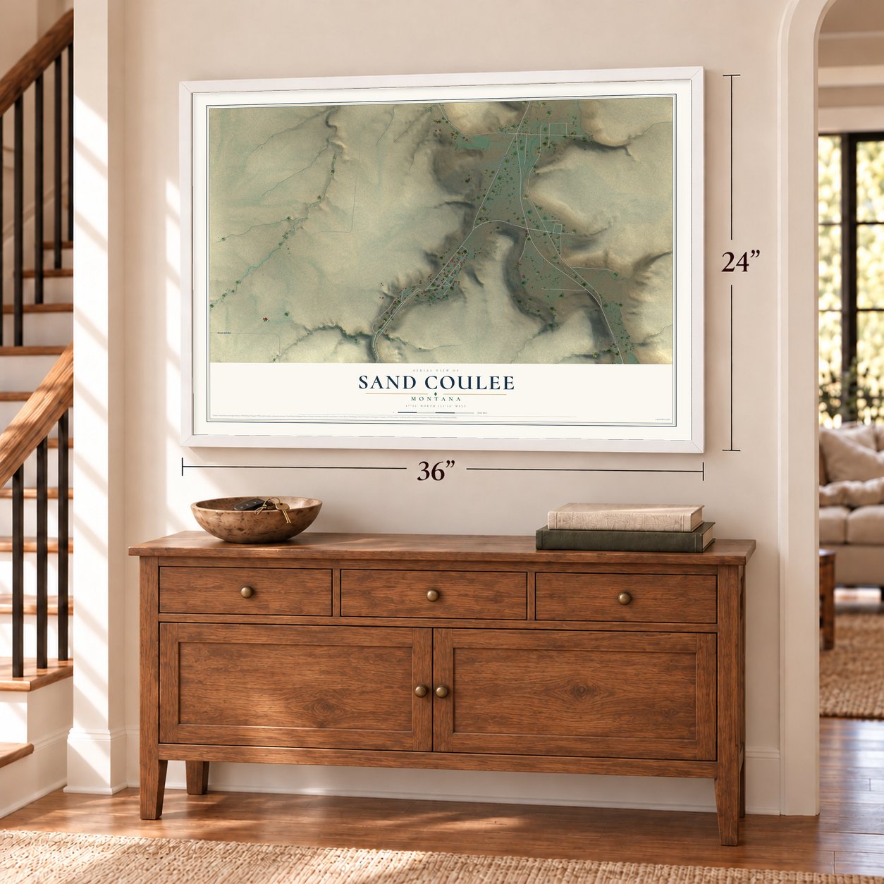 Sand Coulee, Montana map, 24 x 36 inch print in a white frame above a dresser by a staircase