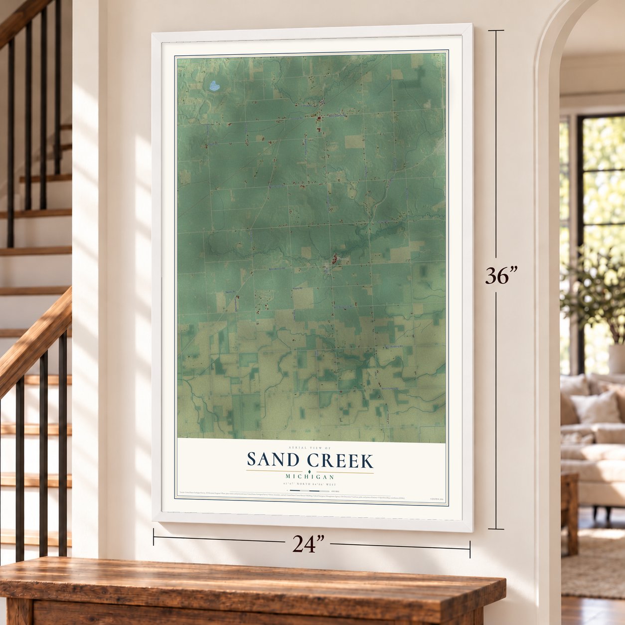 Sand Creek, Michigan map, 24 x 36 inch print in a white frame by a staircase