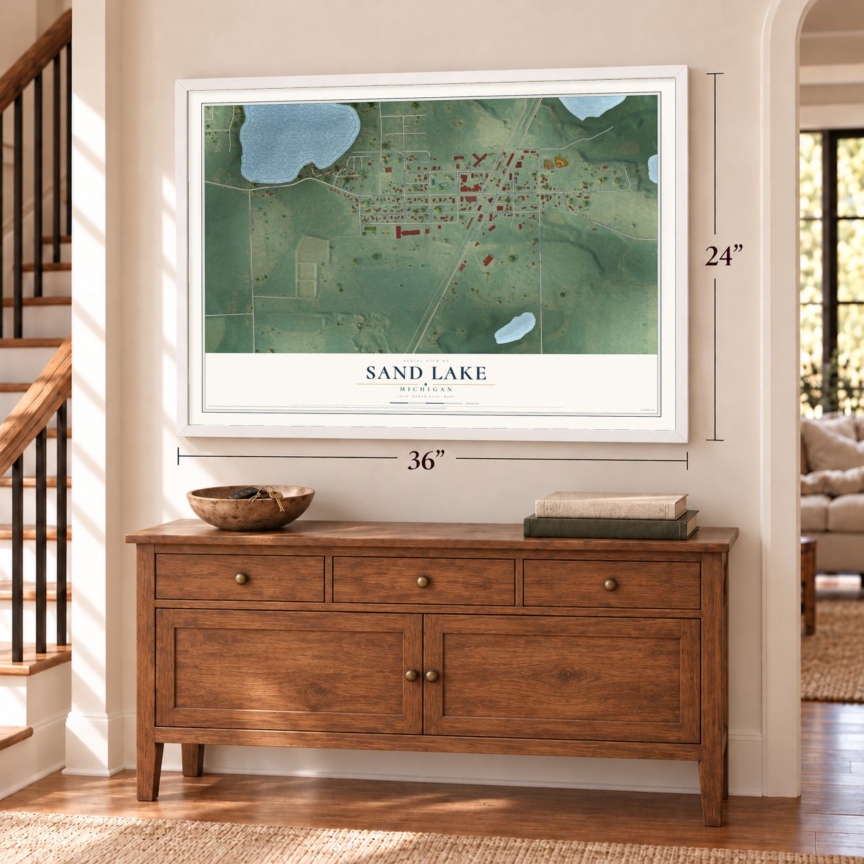 Sand Lake, Michigan map, 24 x 36 inch print in a white frame above a dresser by a staircase