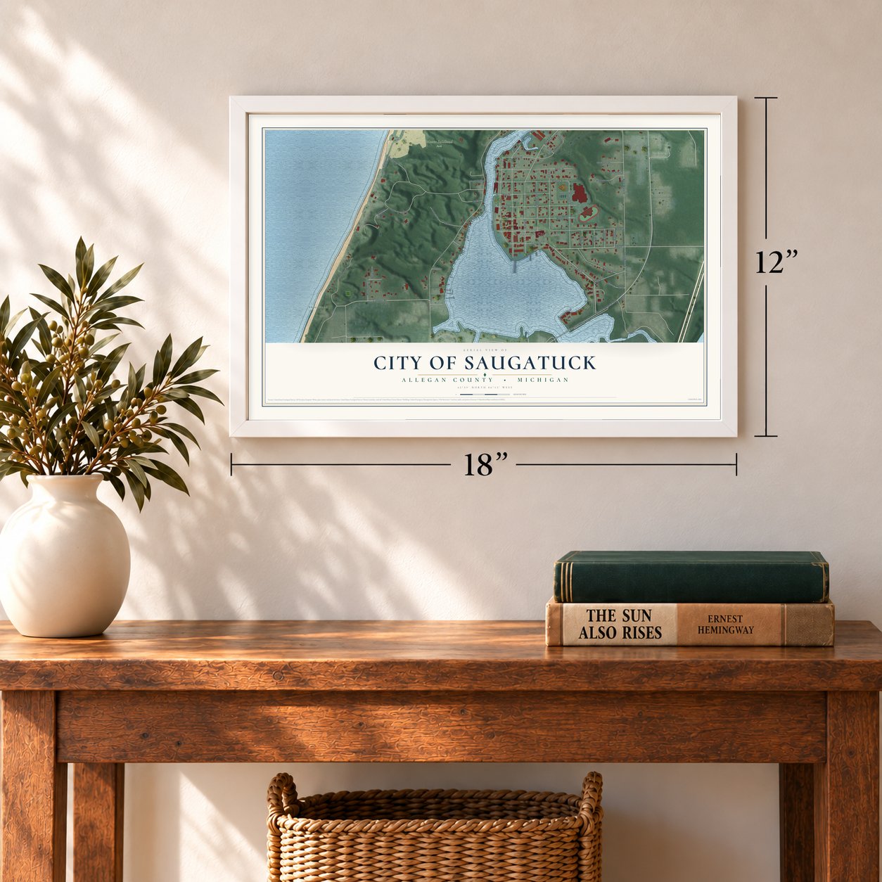 Saugatuck, Michigan map, 12 x 18 inch print in a white frame in an entryway