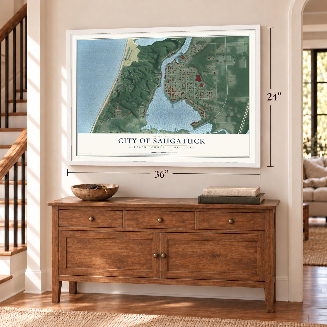 Saugatuck, Michigan map, 24 x 36 inch print in a white frame above a dresser by a staircase