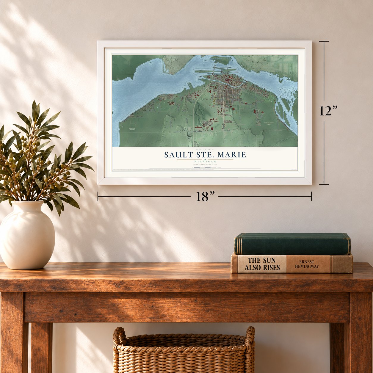 Sault Ste. Marie, Michigan map, 12 x 18 inch print in a white frame in an entryway