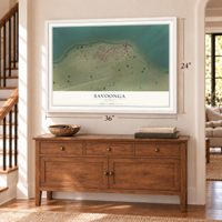 Savoonga, Alaska map, 24 x 36 inch print in a white frame above a dresser by a staircase
