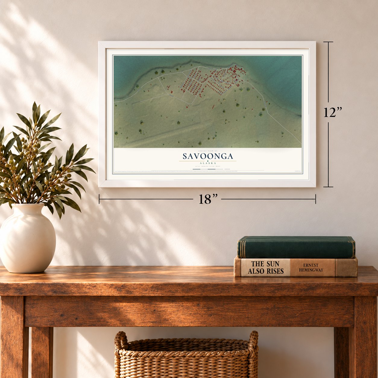 Savoonga, Alaska map, 12 x 18 inch print in a white frame in an entryway