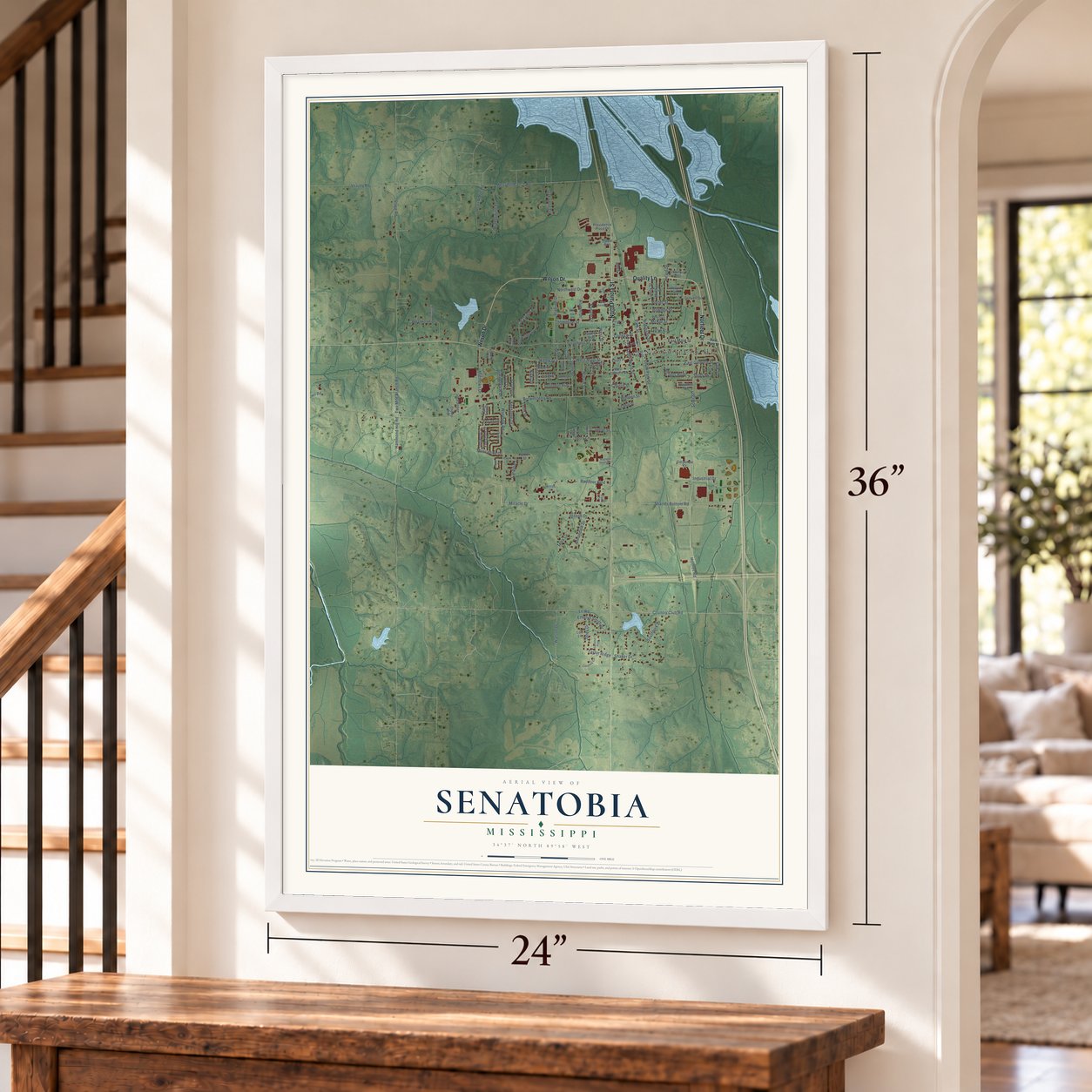 Senatobia, Mississippi map, 24 x 36 inch print in a white frame by a staircase
