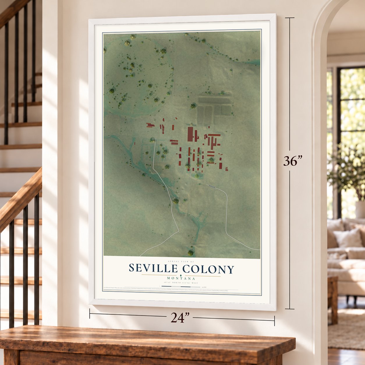 Seville Colony, Montana map, 24 x 36 inch print in a white frame by a staircase