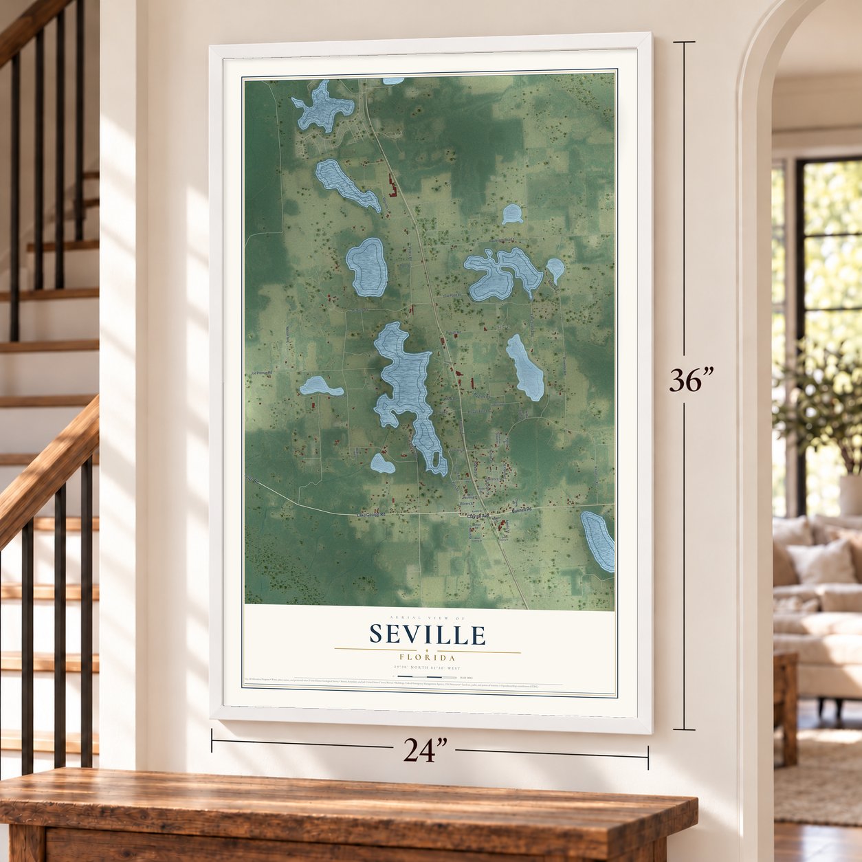 Seville, Florida map, 24 x 36 inch print in a white frame by a staircase