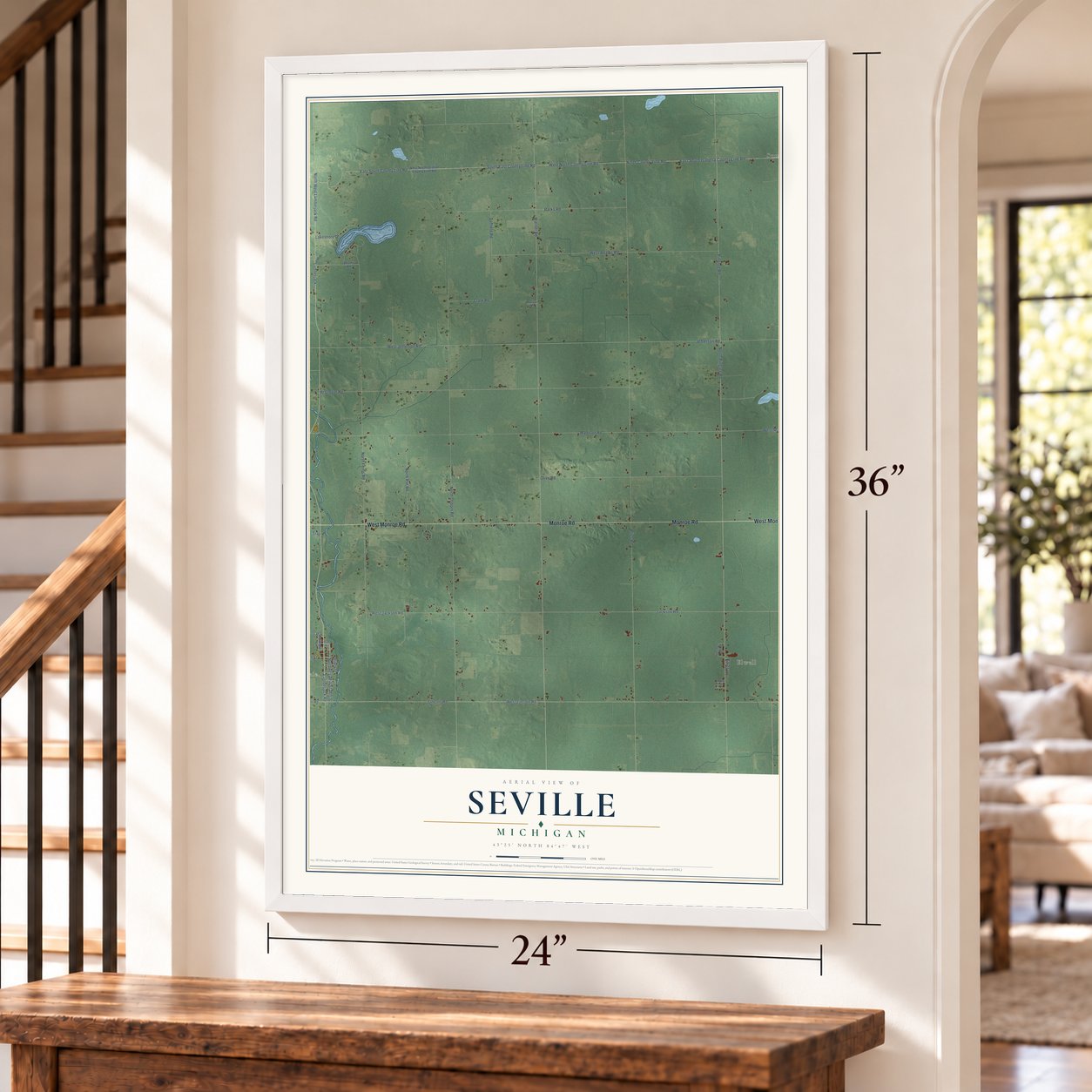 Seville, Michigan map, 24 x 36 inch print in a white frame by a staircase