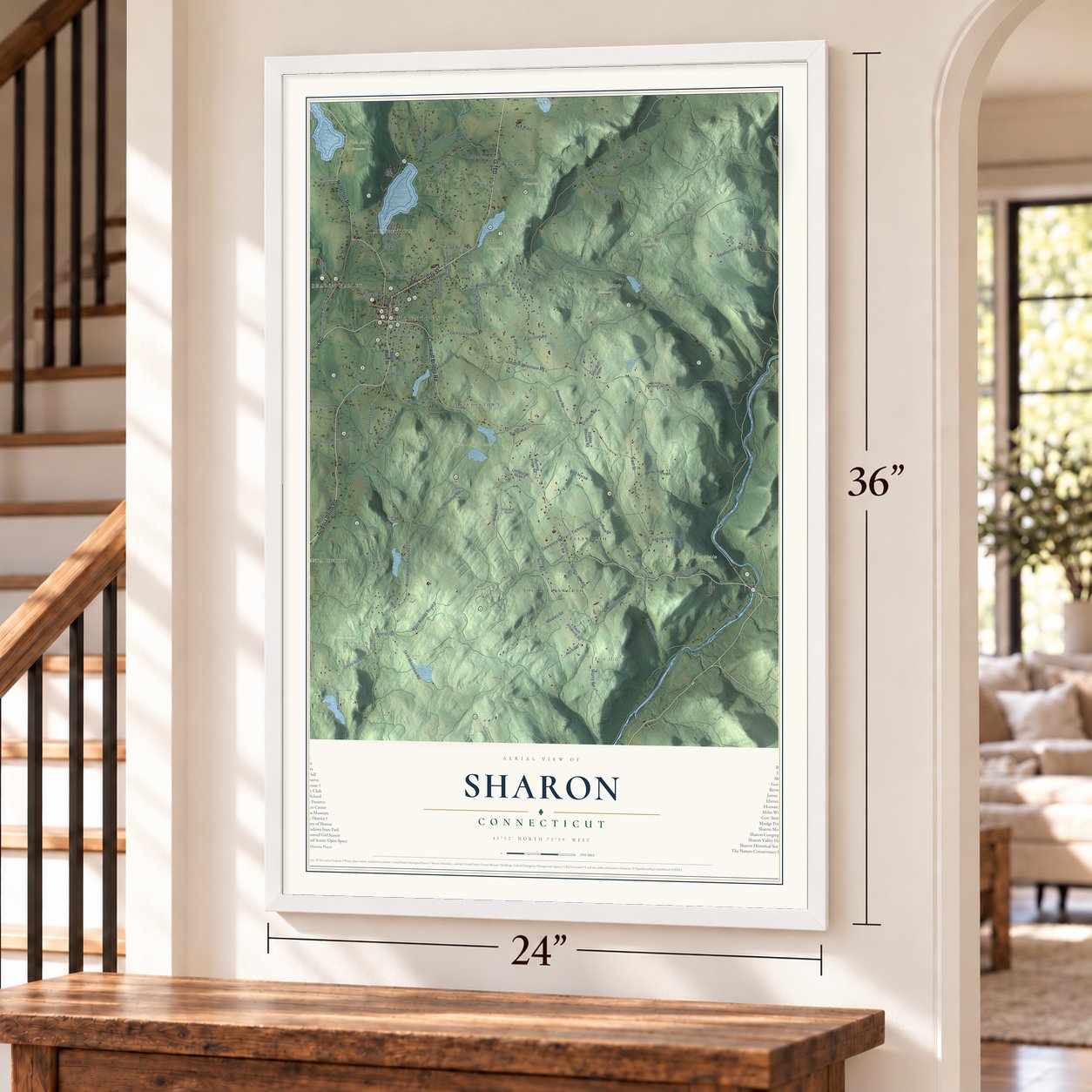 Sharon, Connecticut map, 24 x 36 inch print in a white frame by a staircase
