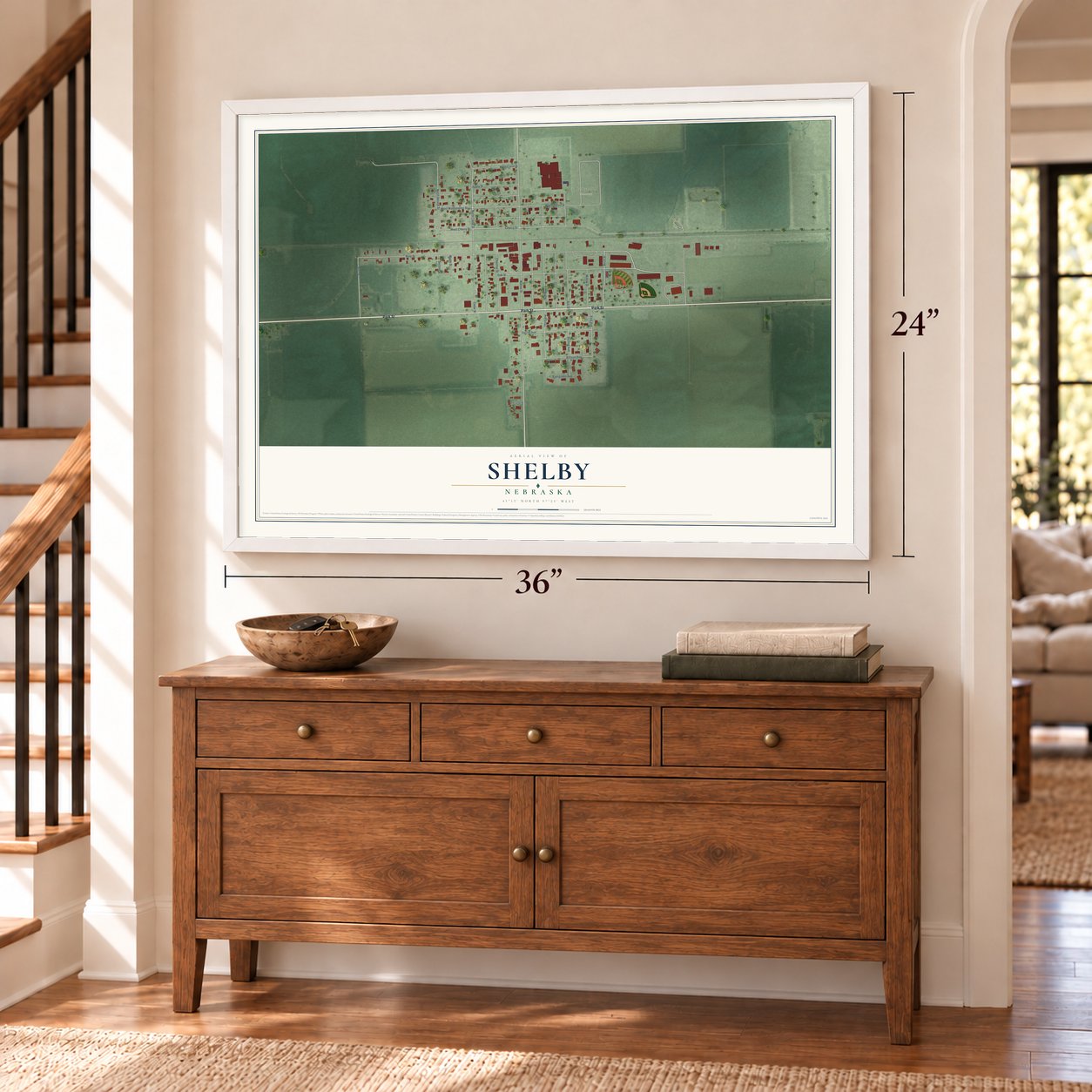 Shelby, Nebraska map, 24 x 36 inch print in a white frame above a dresser by a staircase