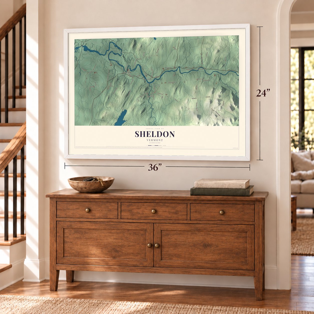 Sheldon, Vermont map, 24 x 36 inch print in a white frame above a dresser by a staircase