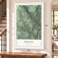 Shelton, Connecticut map, 24 x 36 inch print in a white frame by a staircase