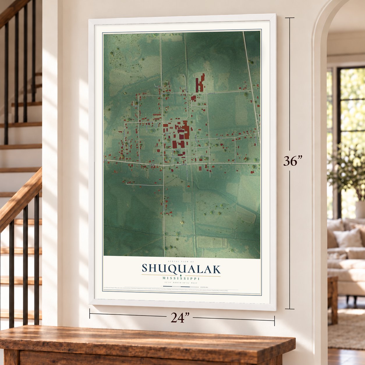 Shuqualak, Mississippi map, 24 x 36 inch print in a white frame by a staircase