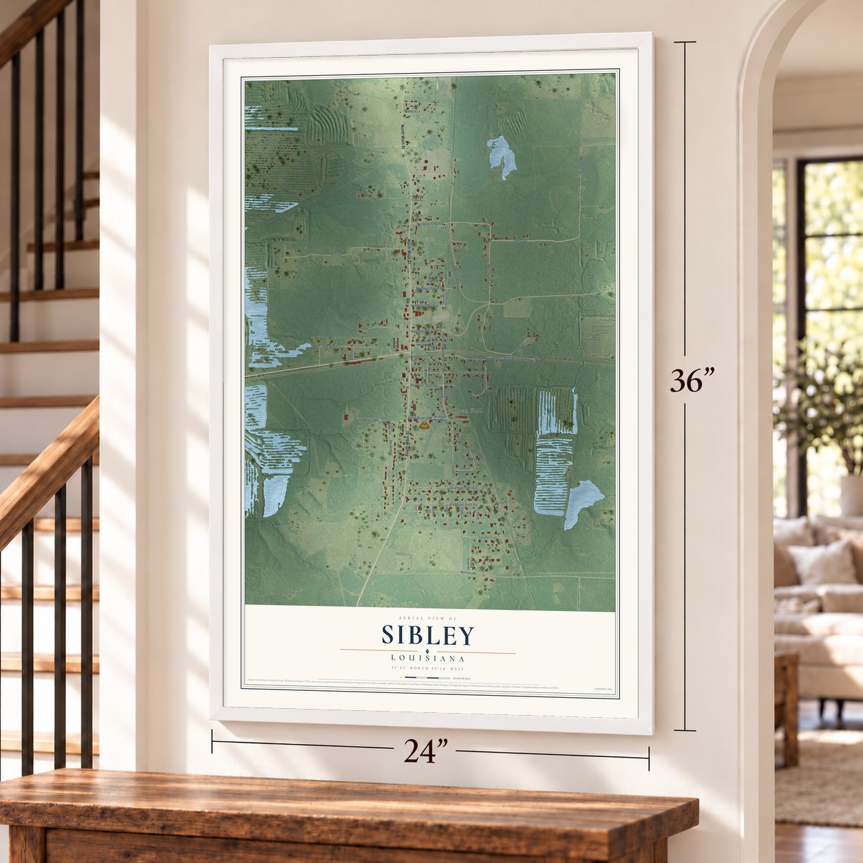 Sibley, Louisiana map, 24 x 36 inch print in a white frame by a staircase