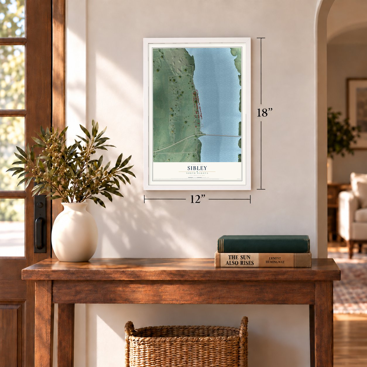 Sibley, North Dakota map, 12 x 18 inch print in a white frame in an entryway