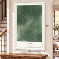 Sikes, Louisiana map, 24 x 36 inch print in a white frame by a staircase