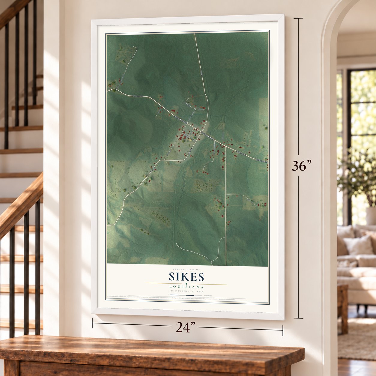 Sikes, Louisiana map, 24 x 36 inch print in a white frame by a staircase