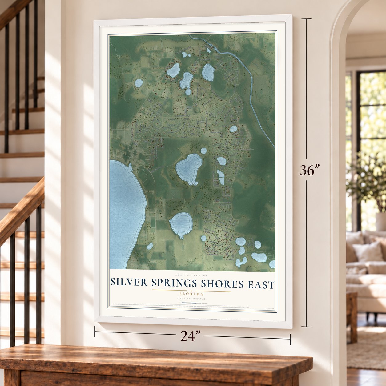 Silver Springs Shores East, Florida map, 24 x 36 inch print in a white frame by a staircase