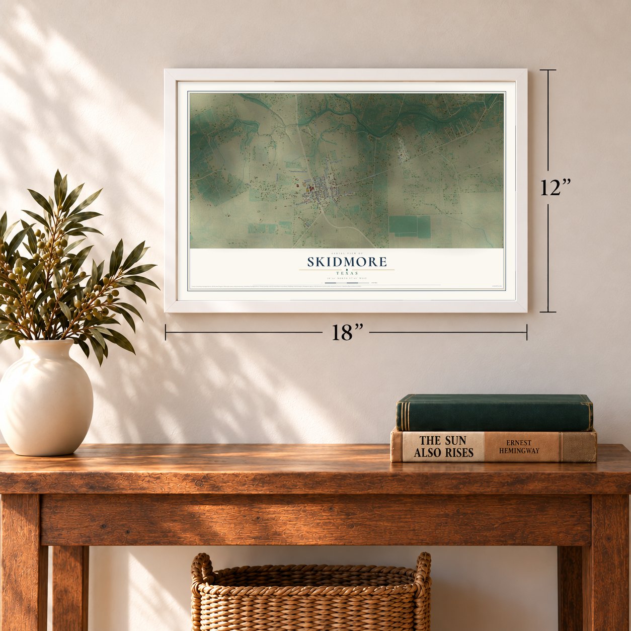 Skidmore, Texas map, 12 x 18 inch print in a white frame in an entryway