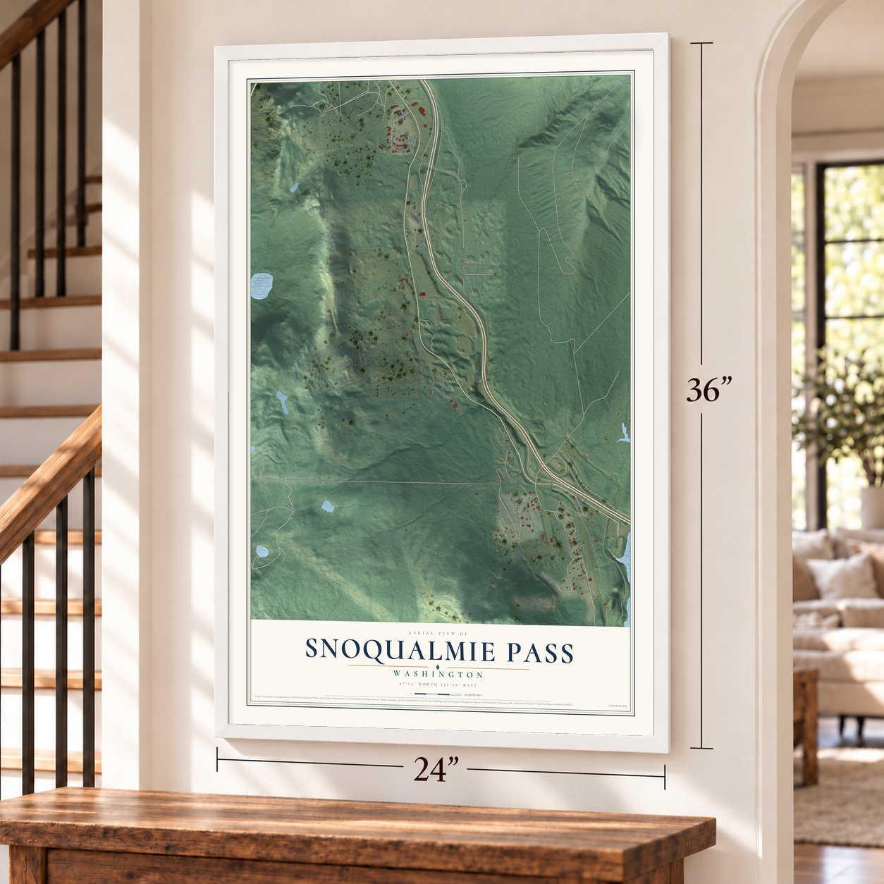 Snoqualmie Pass, Washington map, 24 x 36 inch print in a white frame by a staircase