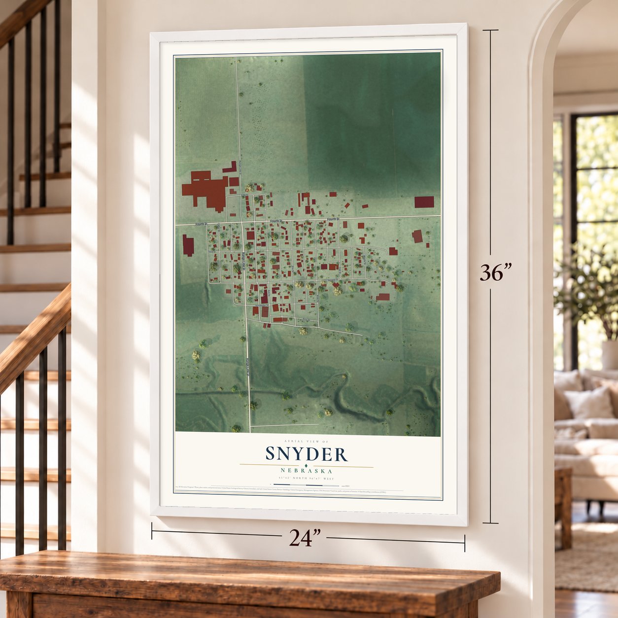 Snyder, Nebraska map, 24 x 36 inch print in a white frame by a staircase
