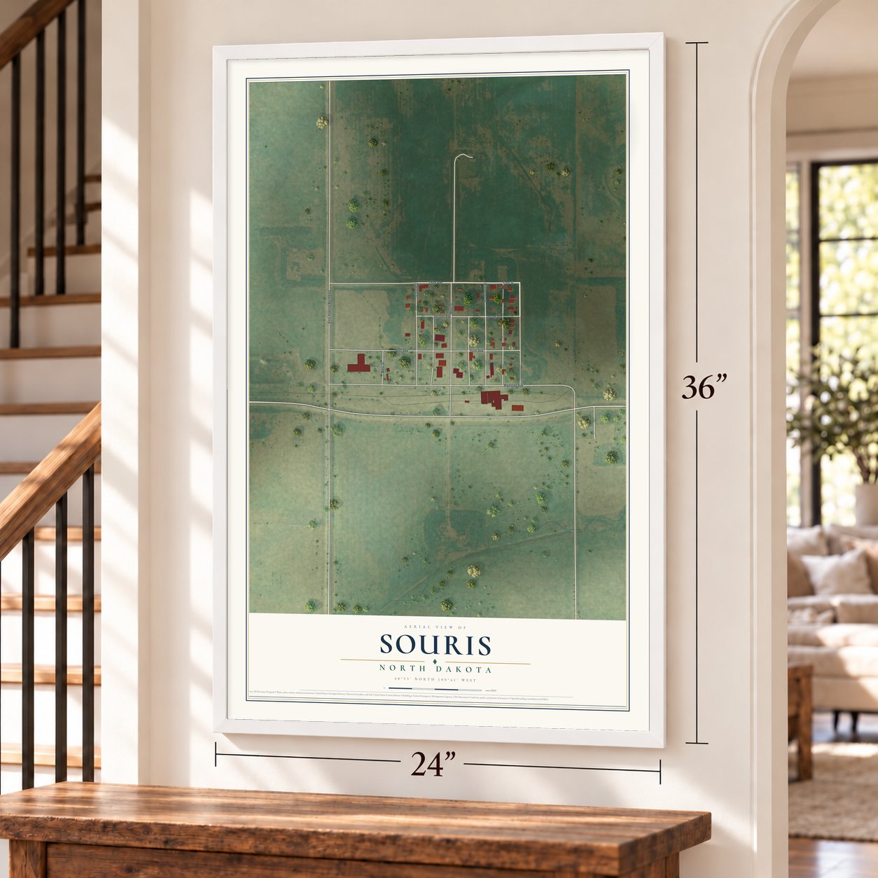 Souris, North Dakota map, 24 x 36 inch print in a white frame by a staircase