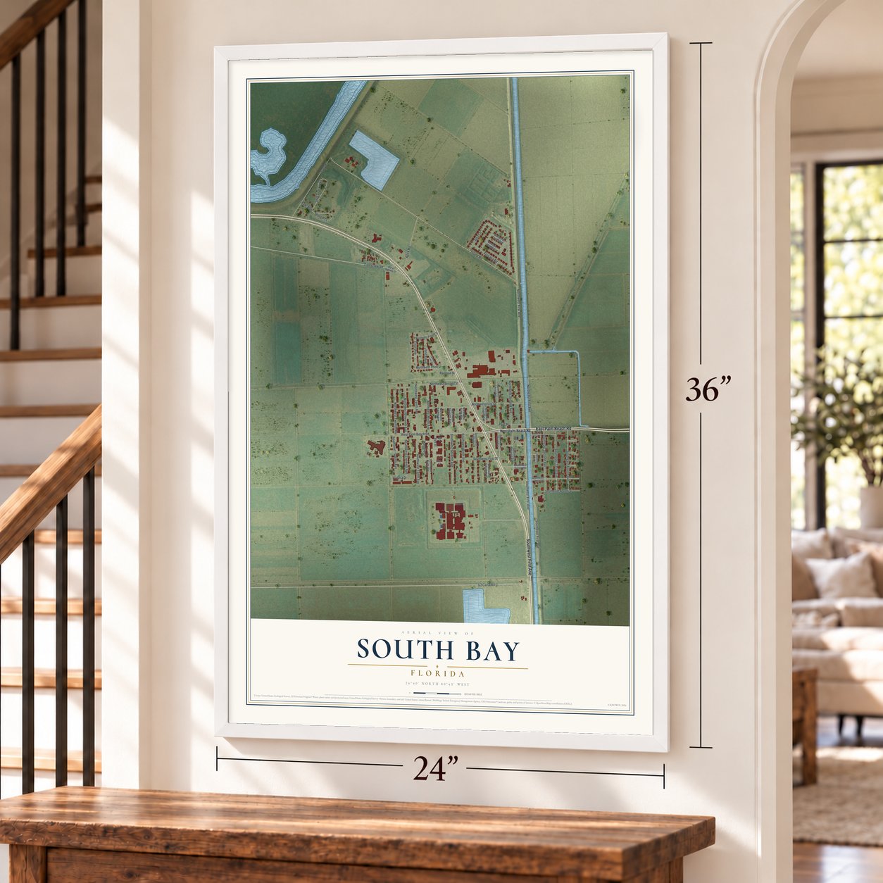 South Bay, Florida map, 24 x 36 inch print in a white frame by a staircase