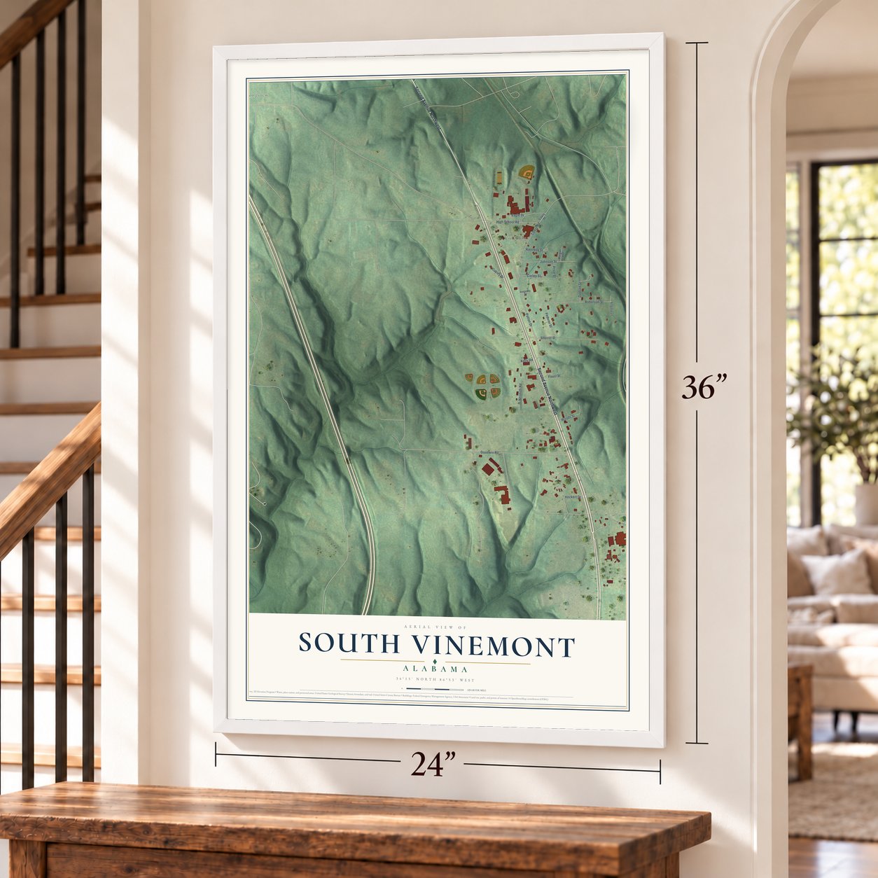 South Vinemont, Alabama map, 24 x 36 inch print in a white frame by a staircase