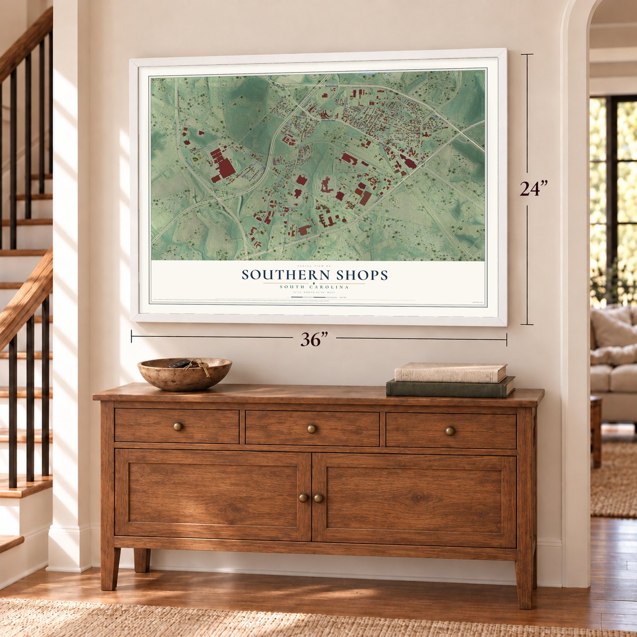 Southern Shops, South Carolina map, 24 x 36 inch print in a white frame above a dresser by a staircase