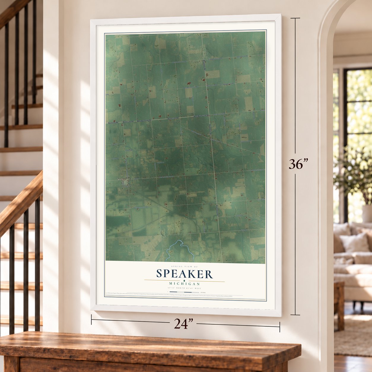 Speaker, Michigan map, 24 x 36 inch print in a white frame by a staircase