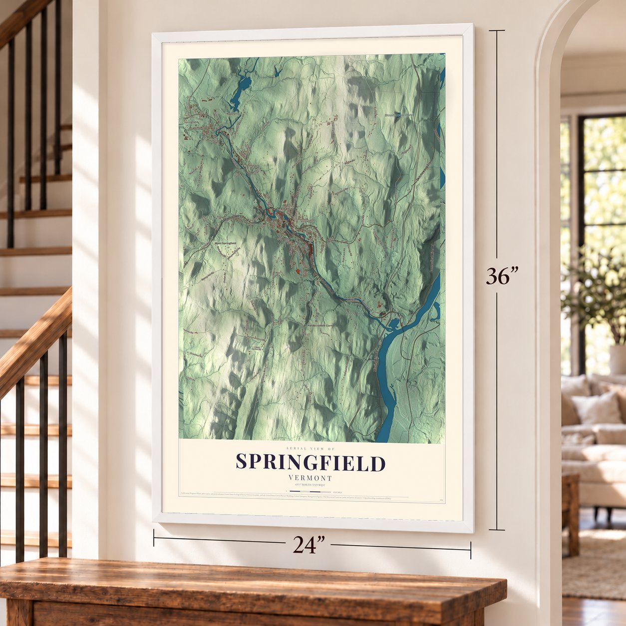 Springfield, Vermont map, 24 x 36 inch print in a white frame by a staircase