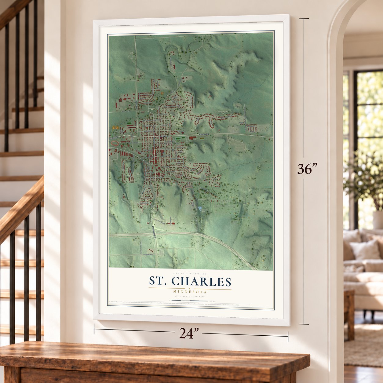 St. Charles, Minnesota map, 24 x 36 inch print in a white frame by a staircase