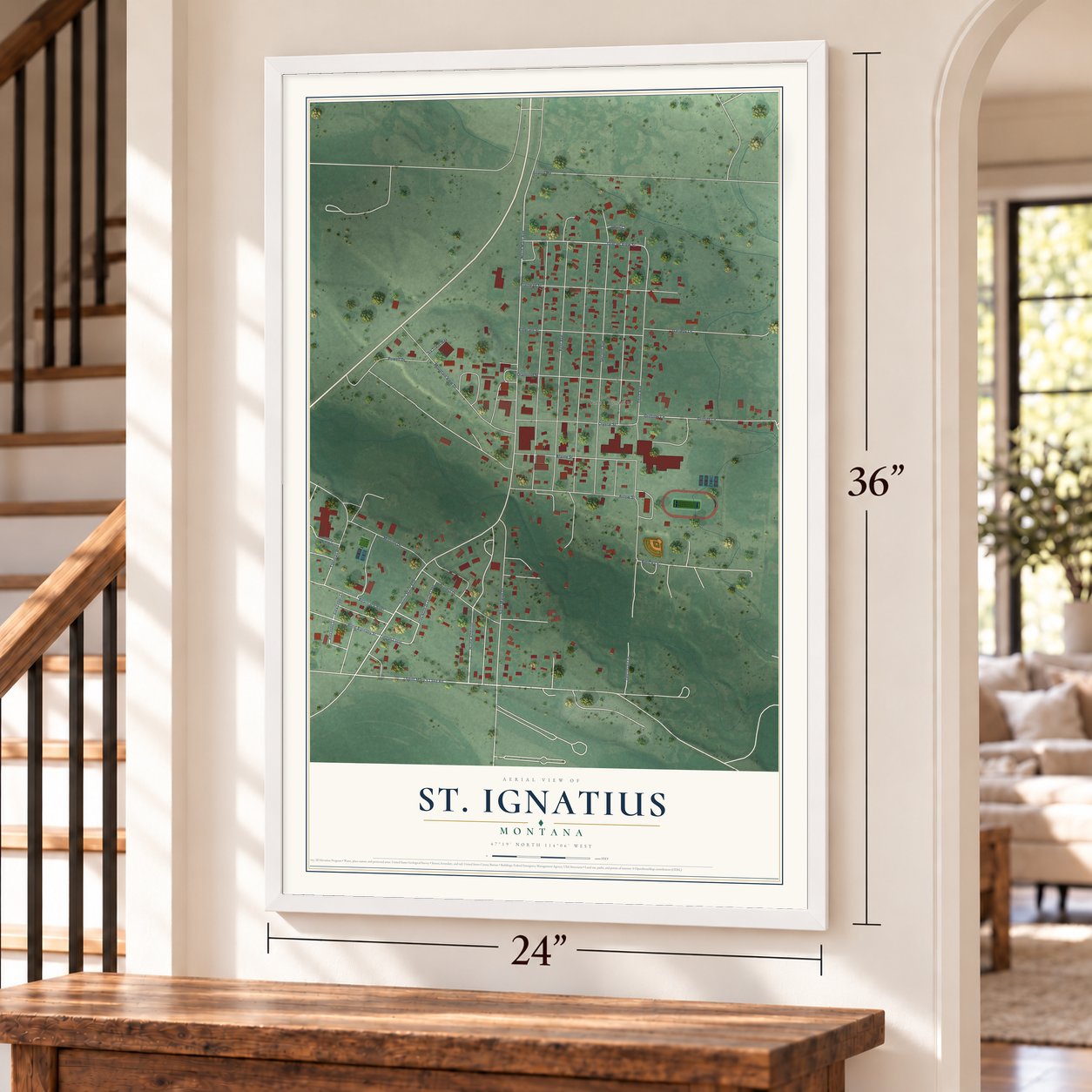 St. Ignatius, Montana map, 24 x 36 inch print in a white frame by a staircase