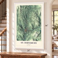 St. Johnsbury, Vermont map, 24 x 36 inch print in a white frame by a staircase