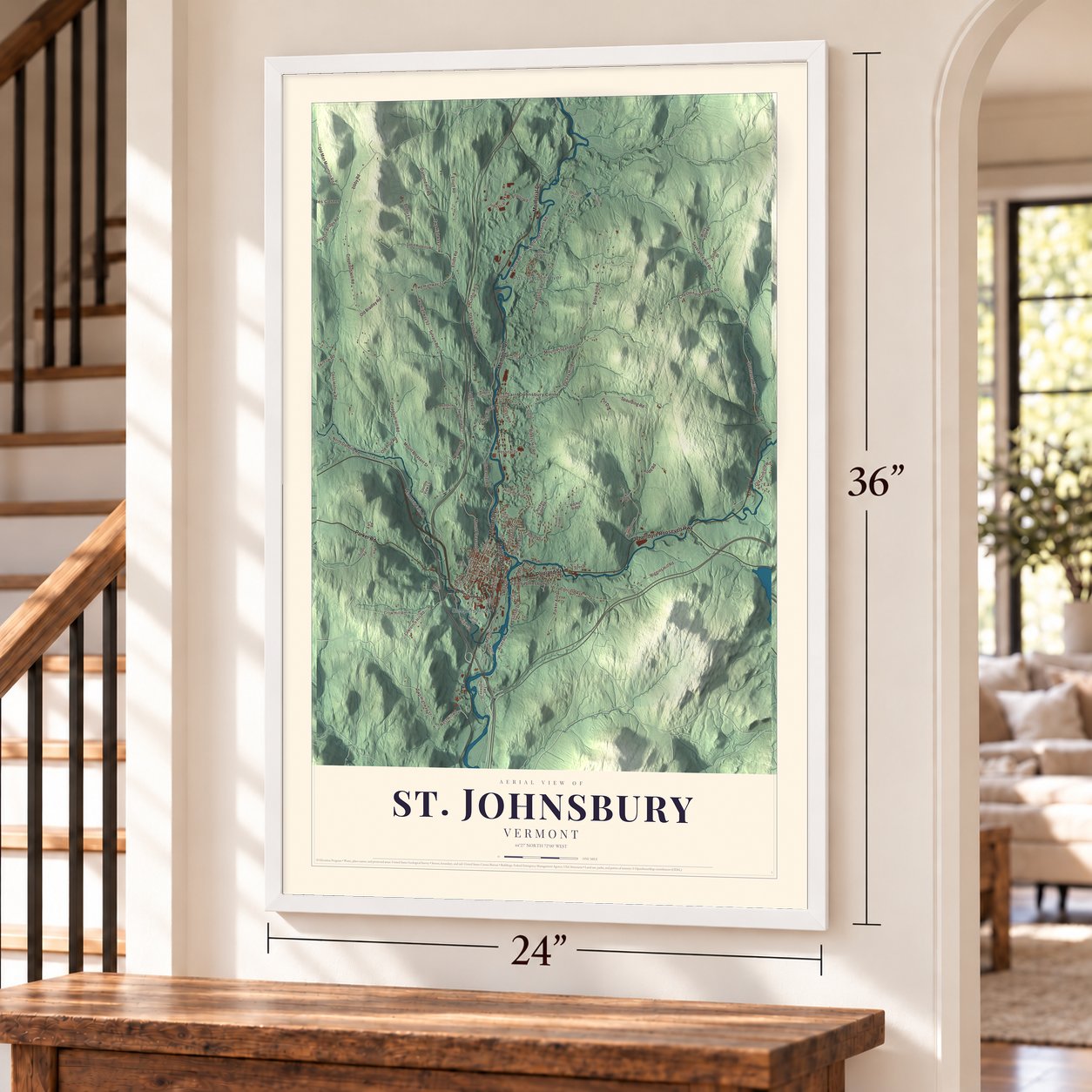 St. Johnsbury, Vermont map, 24 x 36 inch print in a white frame by a staircase