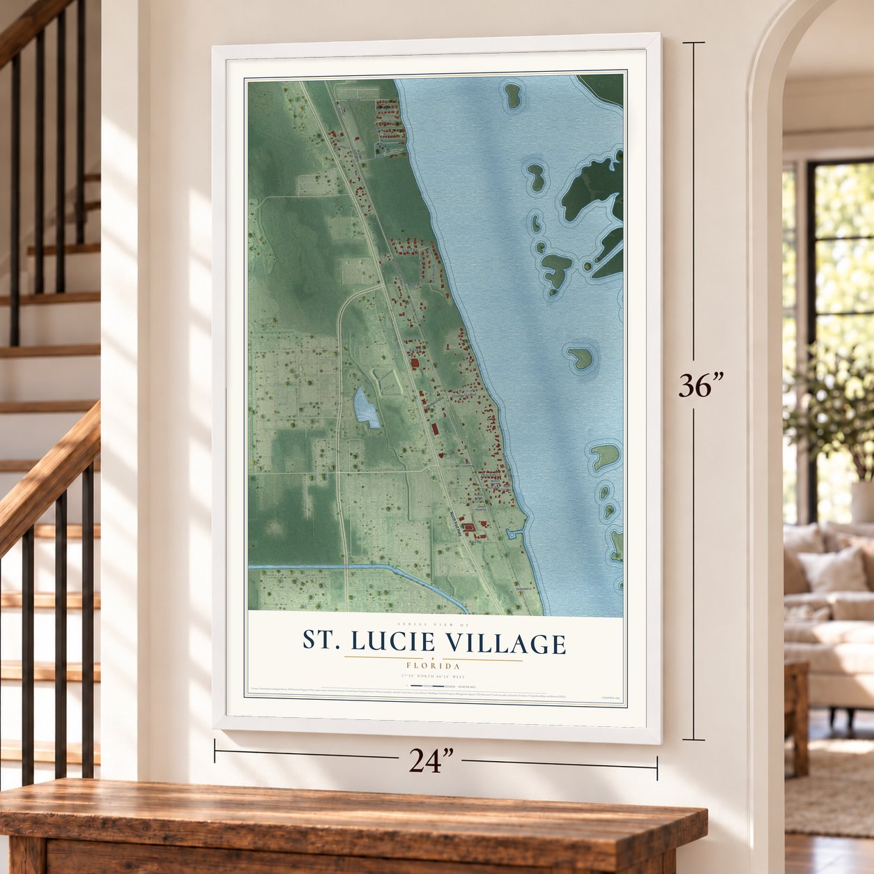 St. Lucie Village, Florida map, 24 x 36 inch print in a white frame by a staircase