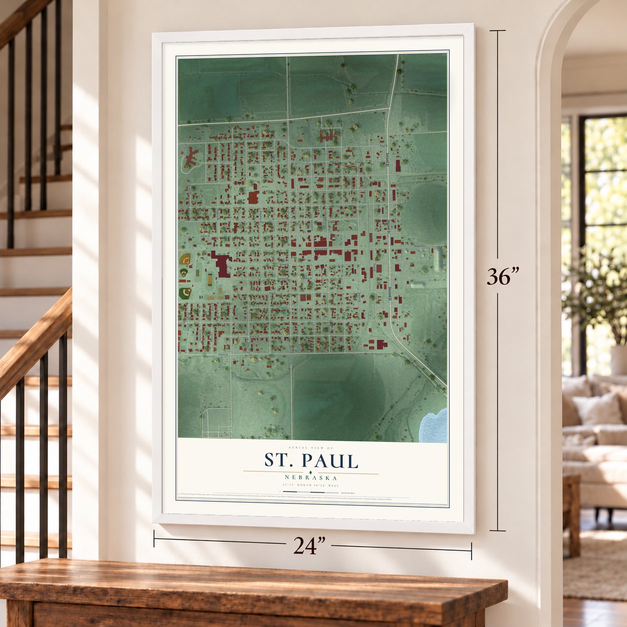 St. Paul, Nebraska map, 24 x 36 inch print in a white frame by a staircase