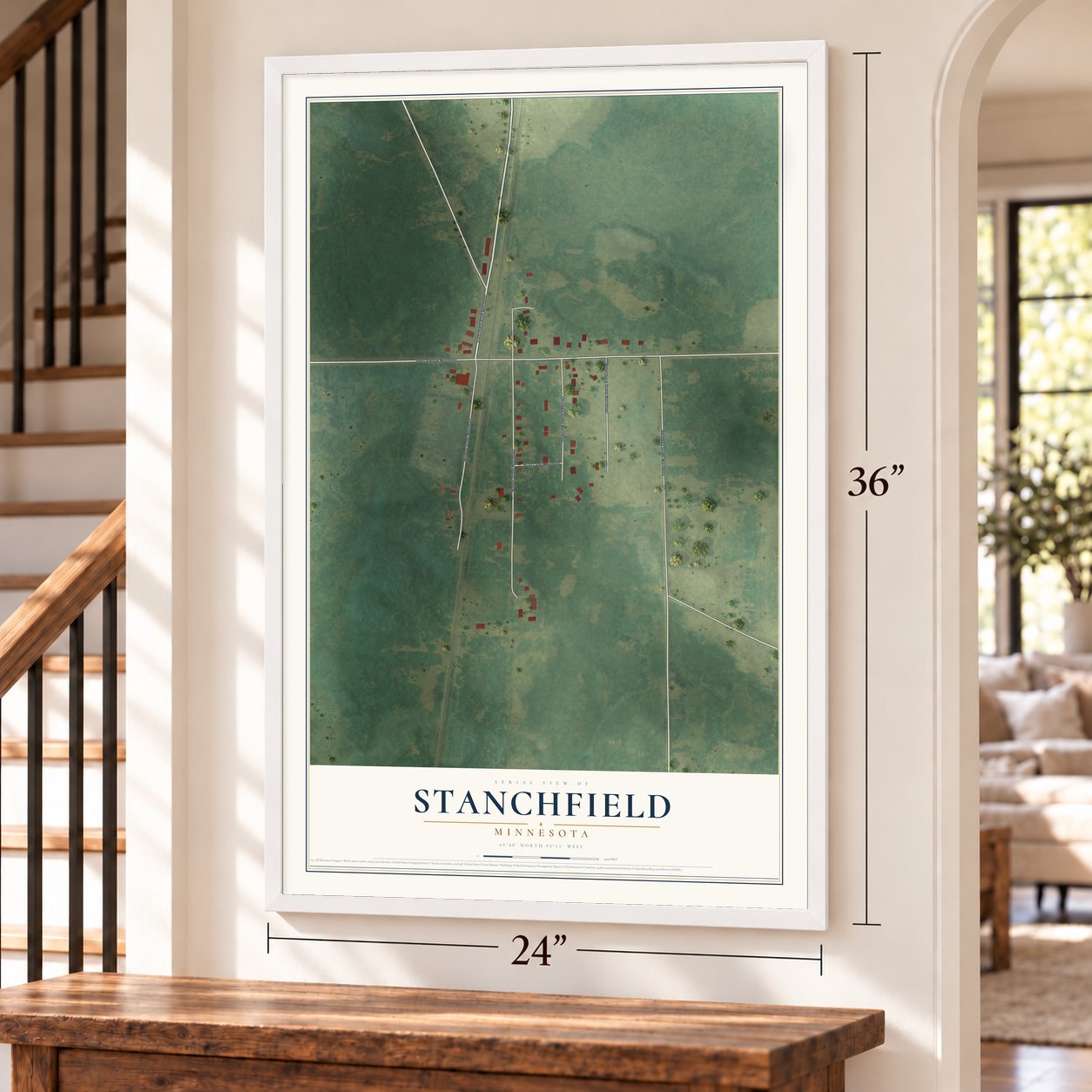 Stanchfield, Minnesota map, 24 x 36 inch print in a white frame by a staircase
