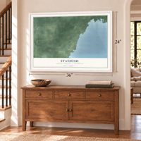 Standish, Arenac County, Michigan map, 24 x 36 inch print in a white frame above a dresser by a staircase
