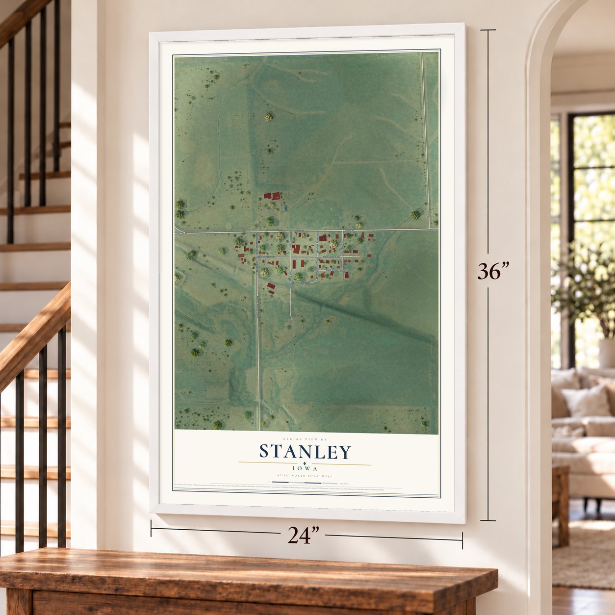 Stanley, Iowa map, 24 x 36 inch print in a white frame by a staircase