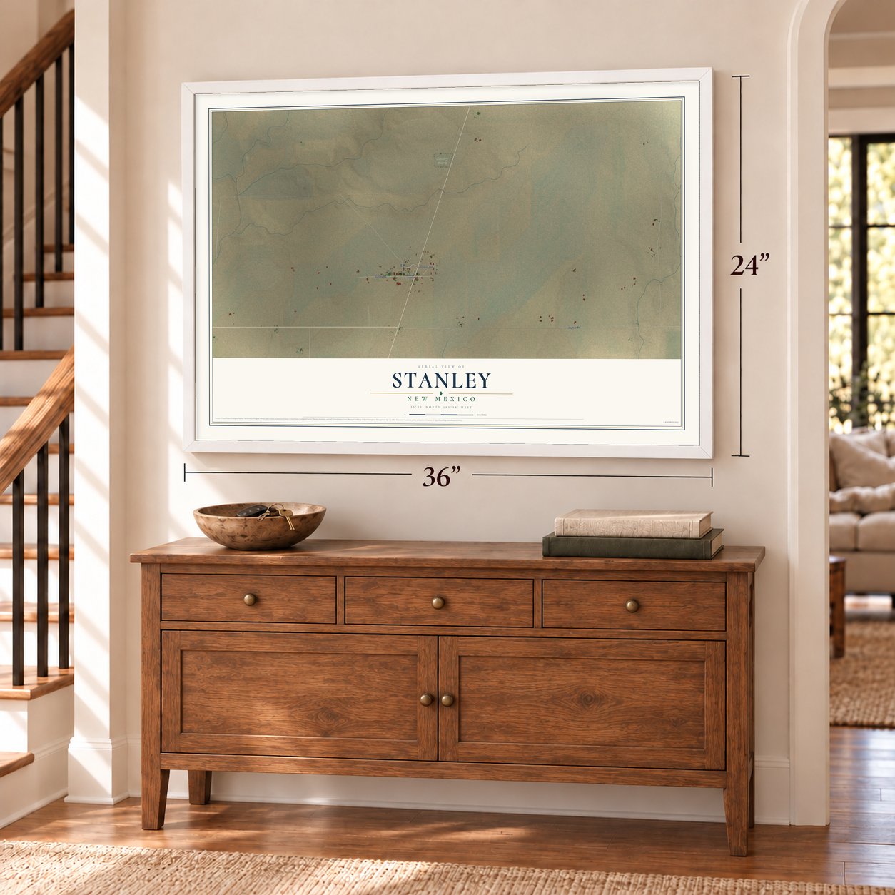 Stanley, New Mexico map, 24 x 36 inch print in a white frame above a dresser by a staircase
